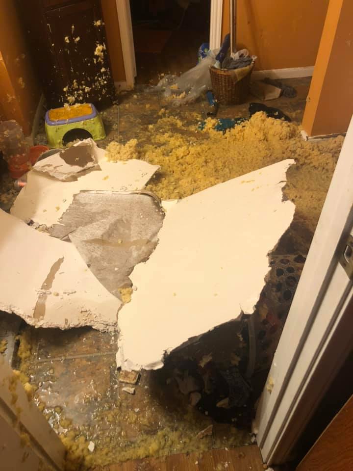 Large pieces of the ceiling broken and on the floor in the master bathroom. 